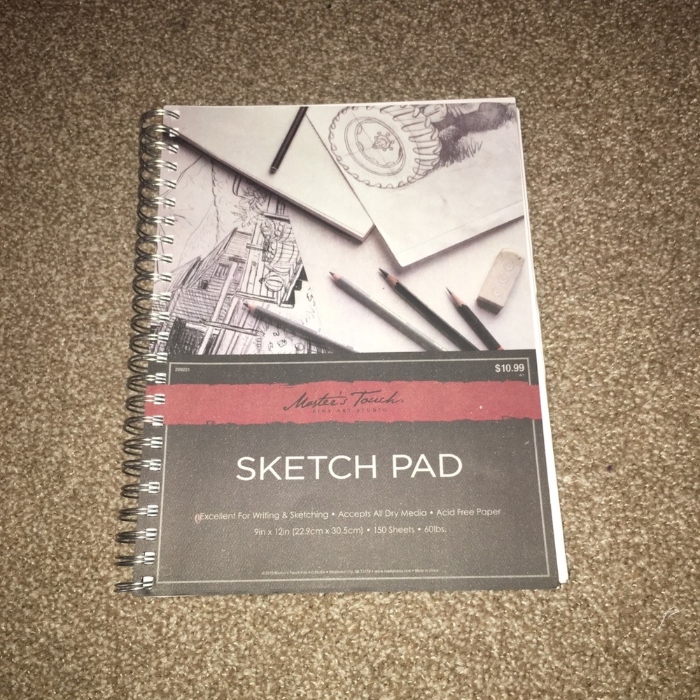 Sketch book, pencils, and sharpener